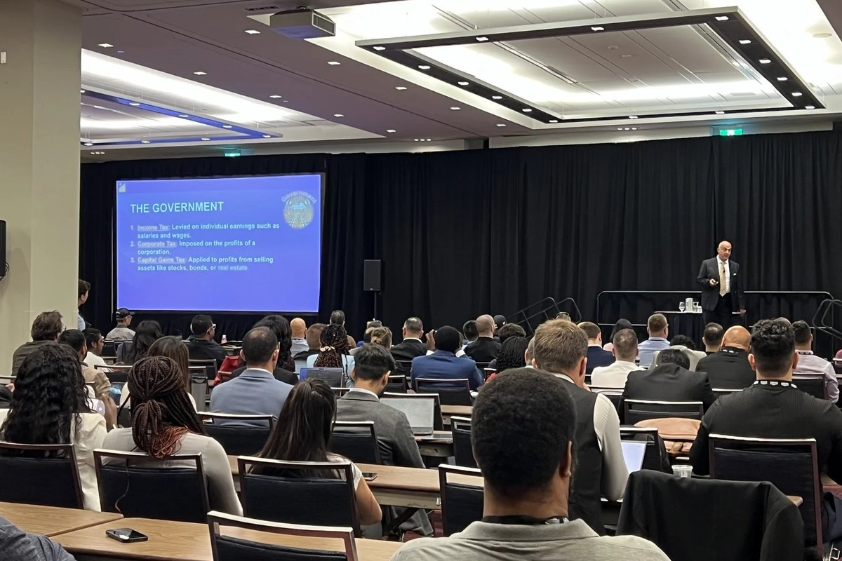 A seminar audience listening to a session led by Jose Salloum in Toronto