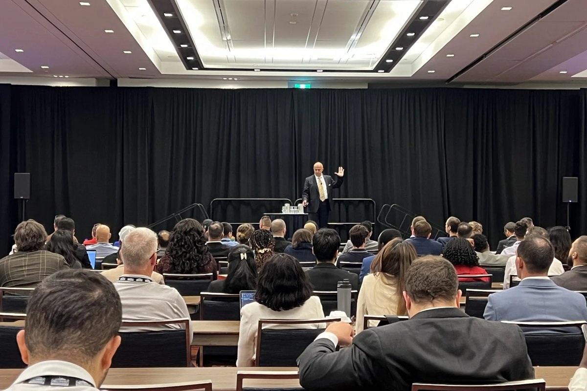 Jose Salloum presenting to a seminar room of attendees in Toronto